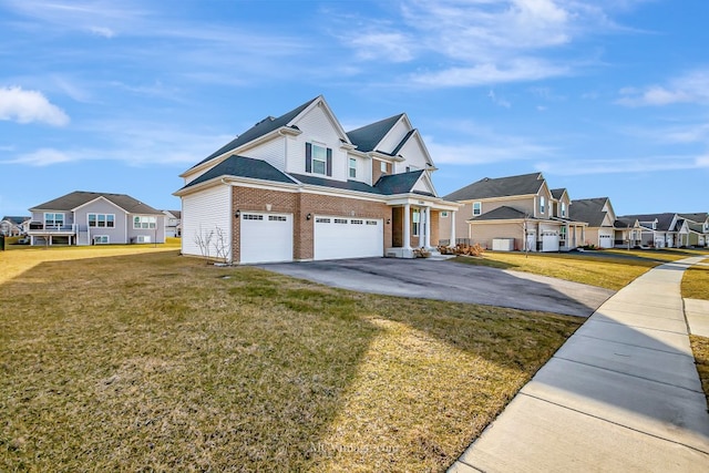 view of front of home with a garage and a front yard