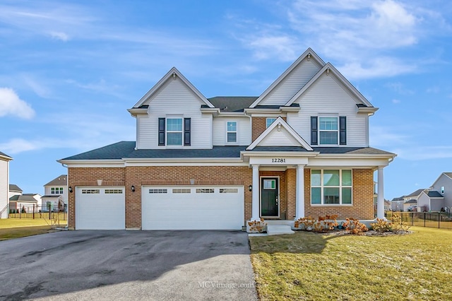 view of front facade with a garage and a front yard