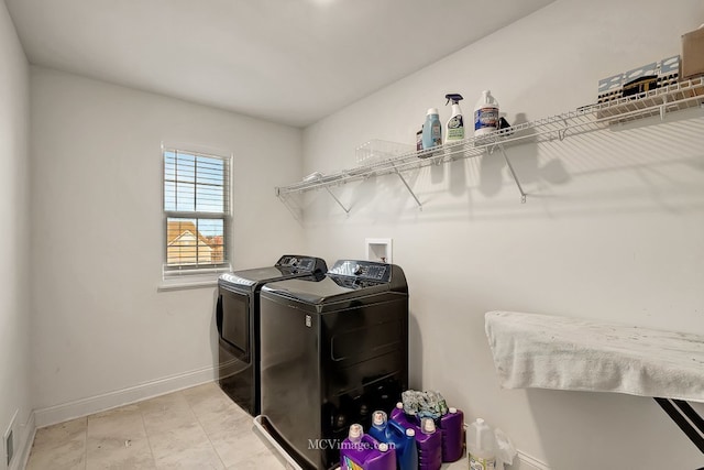 washroom with washing machine and dryer