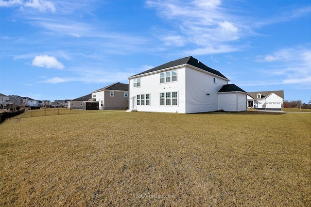 back of house with a yard