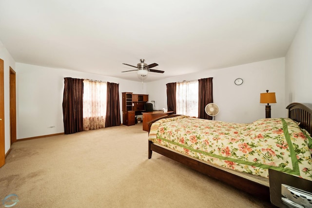 bedroom featuring light colored carpet and ceiling fan