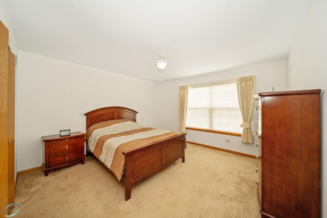 bedroom featuring light carpet