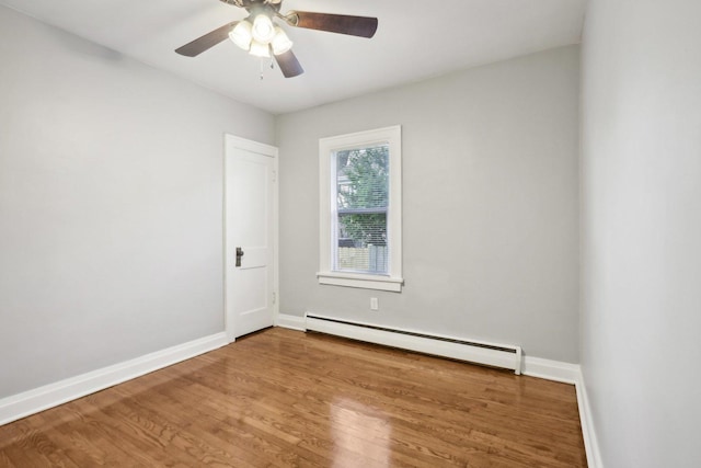 unfurnished room with baseboard heating, ceiling fan, and wood-type flooring