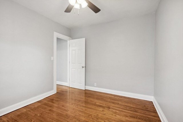 spare room with ceiling fan and hardwood / wood-style floors