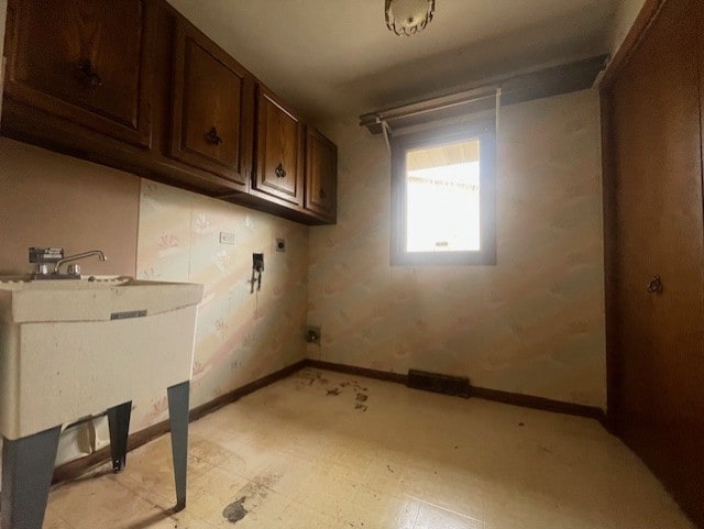 laundry room featuring cabinets, hookup for an electric dryer, and hookup for a washing machine