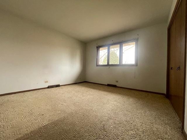 unfurnished room featuring carpet flooring