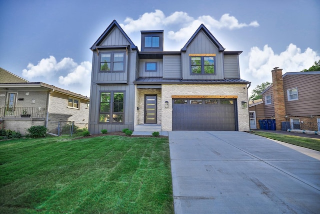 view of front of property featuring a garage and a front yard