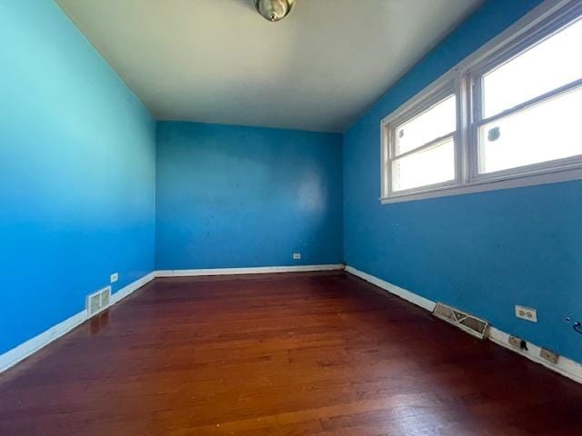 bonus room with dark wood-type flooring