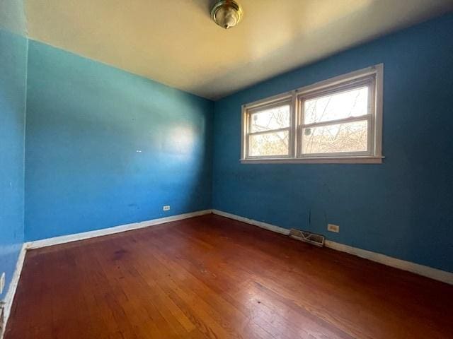 unfurnished room featuring hardwood / wood-style floors