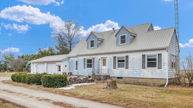 cape cod-style house featuring a garage and a front yard