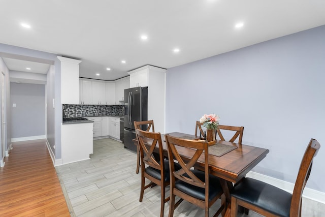 dining area with light hardwood / wood-style floors