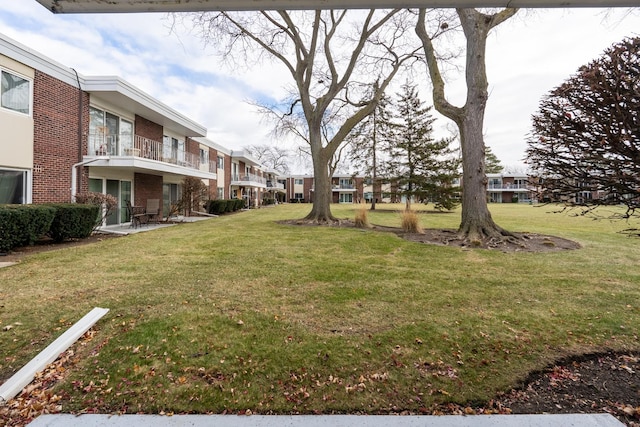 view of property's community with a yard