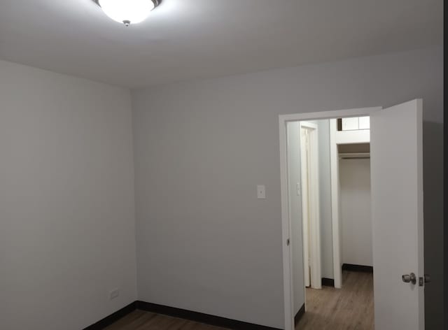 spare room with hardwood / wood-style flooring