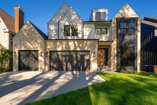 view of front facade featuring a garage and a front yard