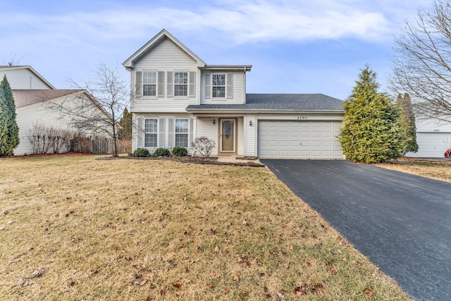 front facade with a garage and a front lawn