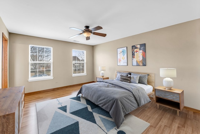 bedroom featuring ceiling fan and light hardwood / wood-style floors