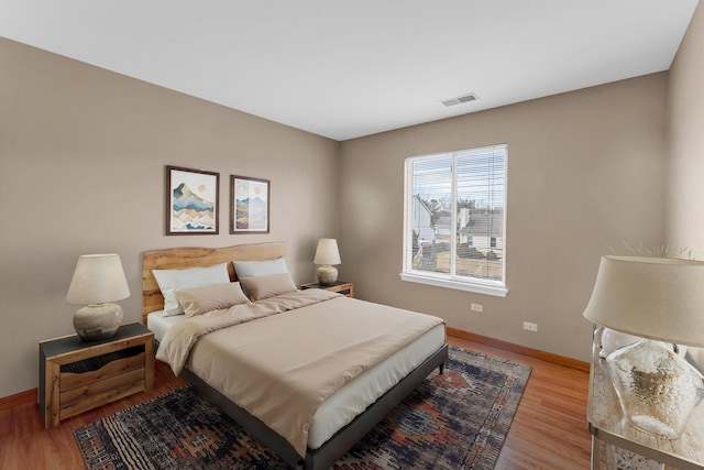 bedroom with light hardwood / wood-style floors