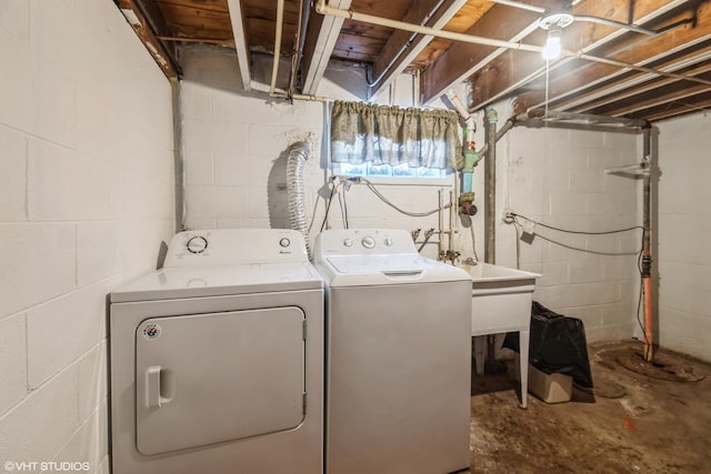 clothes washing area with washer and dryer