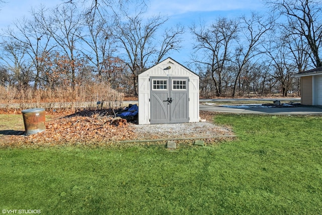 view of outbuilding featuring a yard