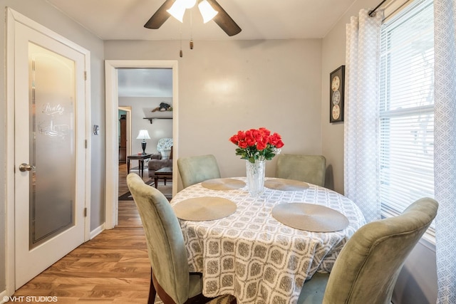 dining room featuring ceiling fan and light hardwood / wood-style flooring