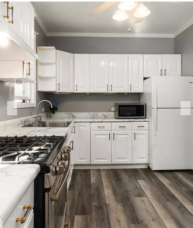 kitchen with crown molding, stainless steel appliances, dark hardwood / wood-style flooring, and white cabinets