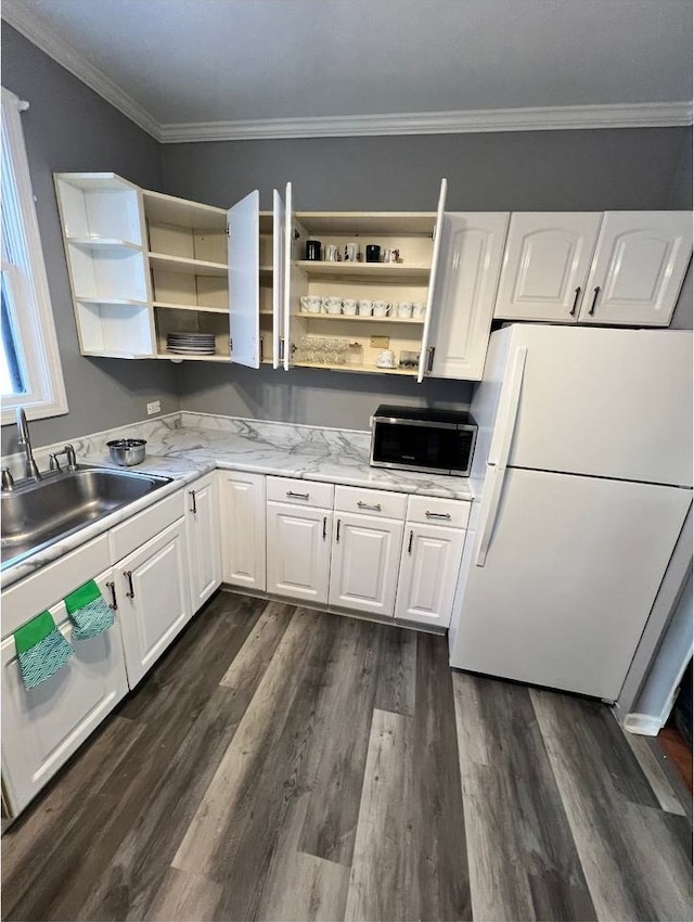 kitchen with white cabinetry, sink, white refrigerator, ornamental molding, and dark wood-type flooring