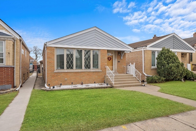 bungalow-style house with a front lawn