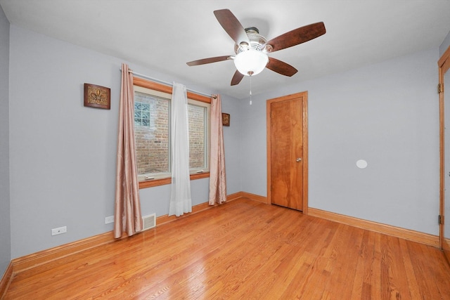 unfurnished room featuring ceiling fan and light hardwood / wood-style flooring