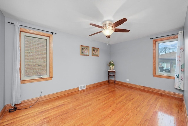 spare room with ceiling fan and light hardwood / wood-style flooring