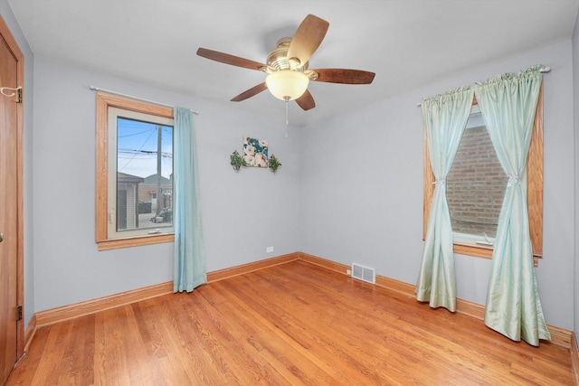 unfurnished room featuring ceiling fan and light hardwood / wood-style flooring