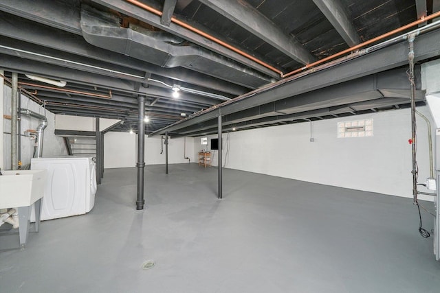 basement with washer and clothes dryer