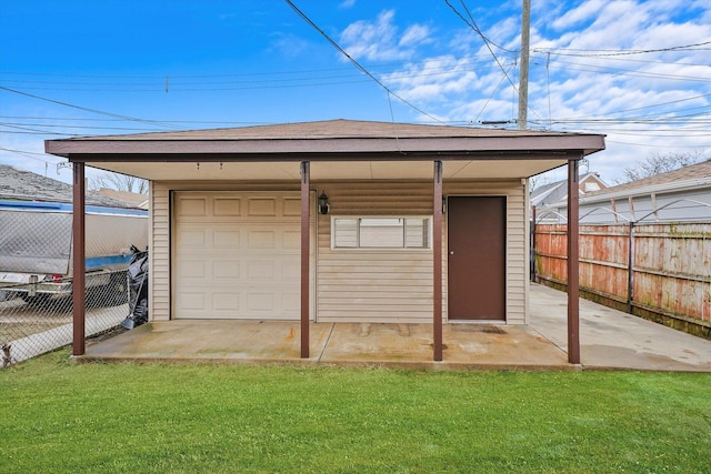 garage featuring a yard