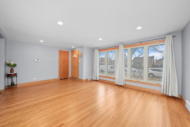 unfurnished living room with light hardwood / wood-style floors