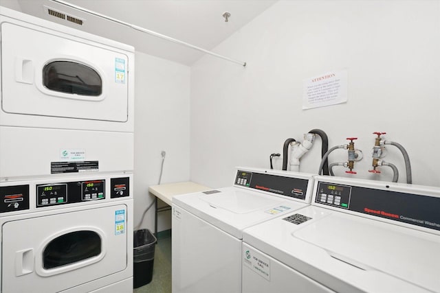 laundry room featuring washer and dryer and stacked washer and clothes dryer