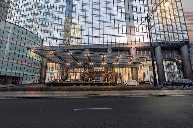 view of outdoor building at dusk