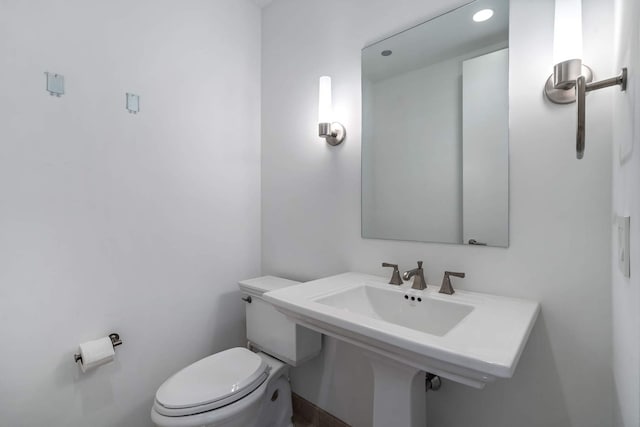 half bath with toilet and recessed lighting