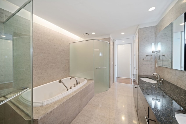 bathroom featuring vanity, recessed lighting, a stall shower, tile patterned floors, and a garden tub