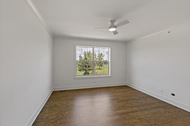 empty room with dark hardwood / wood-style flooring and ceiling fan