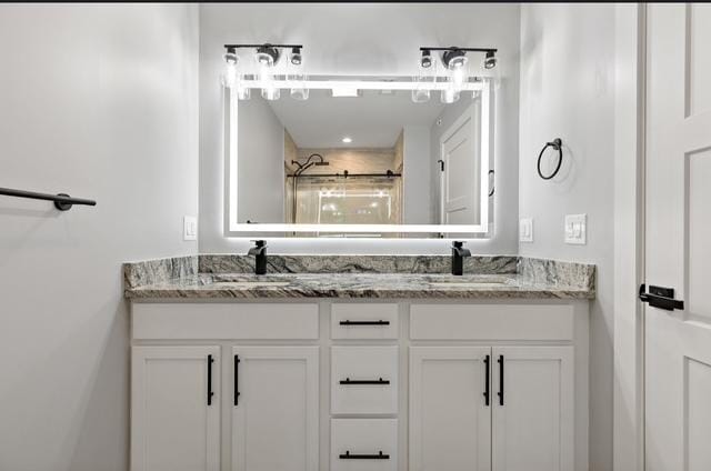 bathroom with vanity and an enclosed shower