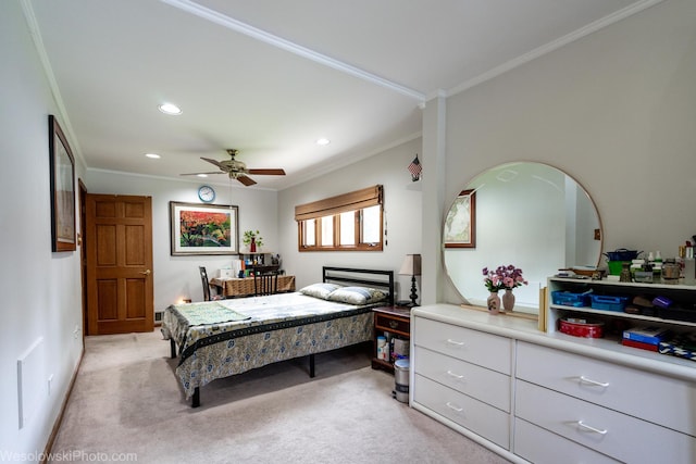 bedroom with crown molding, light colored carpet, and ceiling fan