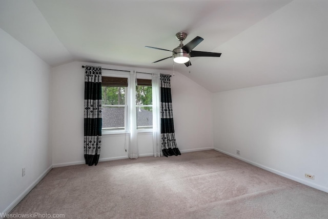 bonus room featuring ceiling fan, carpet flooring, and vaulted ceiling