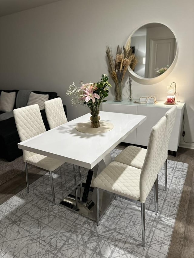 dining area featuring wood-type flooring