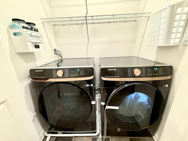 clothes washing area featuring washing machine and clothes dryer