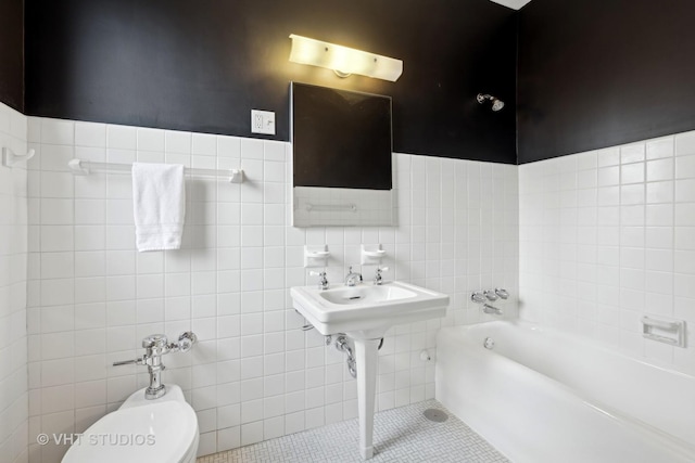 bathroom featuring a tub to relax in, toilet, tile patterned flooring, and tile walls