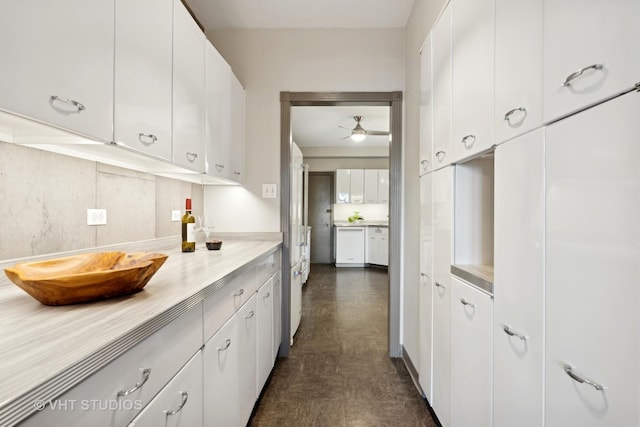 kitchen featuring tasteful backsplash, dishwasher, white cabinets, and ceiling fan