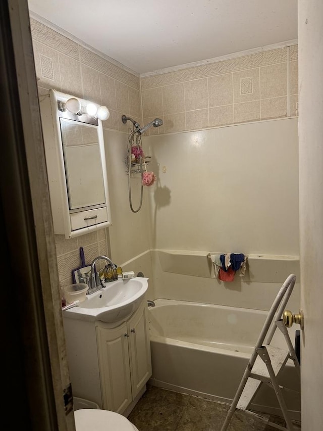 full bathroom featuring vanity, toilet, bathing tub / shower combination, and backsplash