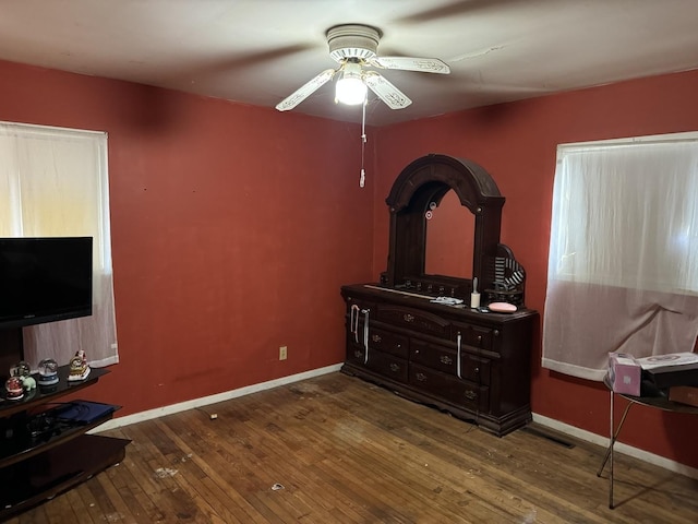 bedroom featuring hardwood / wood-style floors and ceiling fan