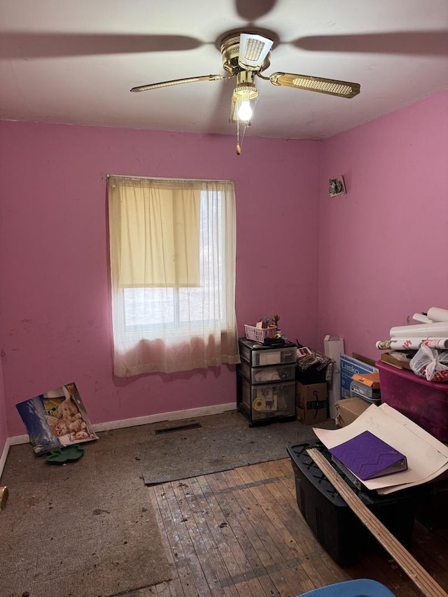 bedroom featuring hardwood / wood-style flooring and ceiling fan