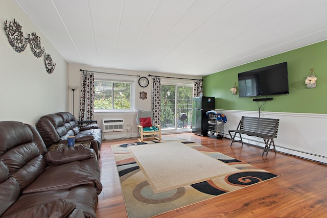 living room featuring hardwood / wood-style floors and an AC wall unit