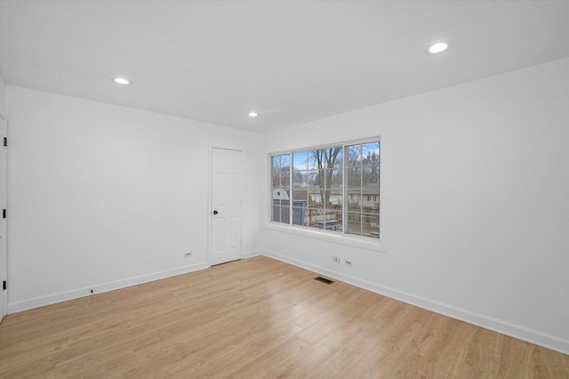 unfurnished room featuring light hardwood / wood-style flooring